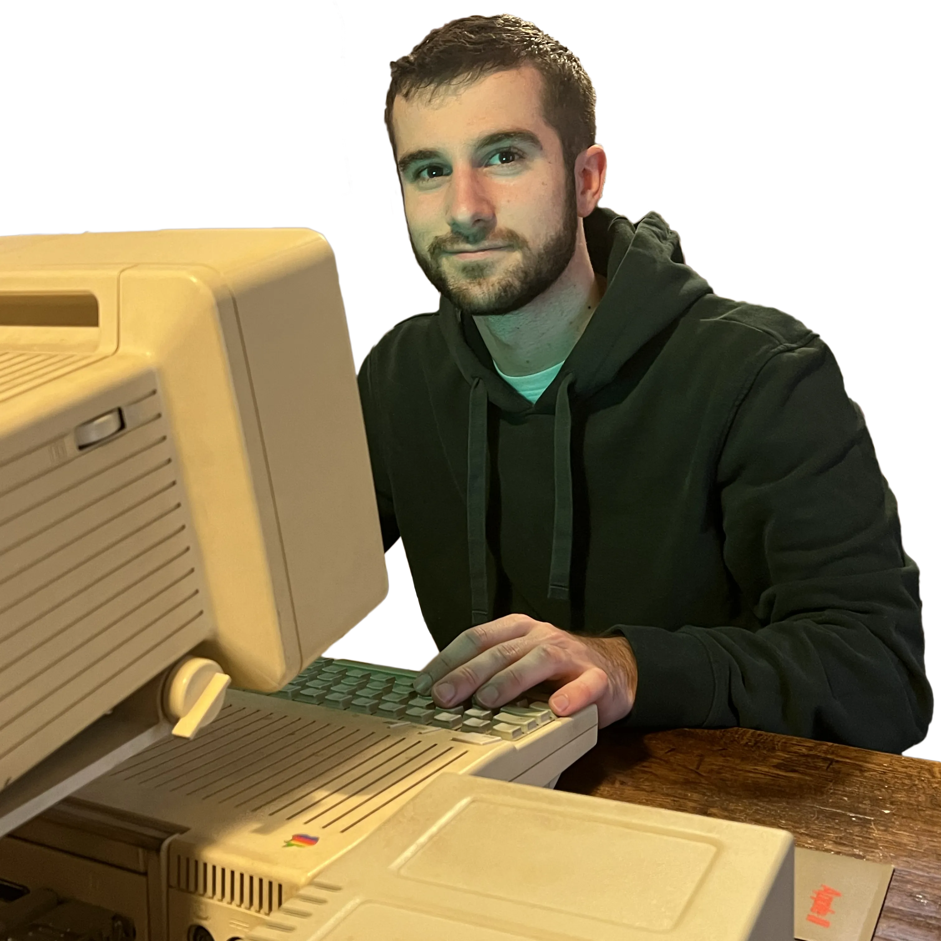 Photograph of Miguel using an Apple 2c computer.